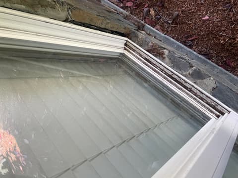 Hazy, streaked window before professional cleaning, Victoria BC
